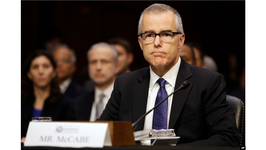 FILE - Acting FBI Director Andrew McCabe listens on Capitol Hill in Washington, May 11, 2017, while testifying before a Senate Intelligence Committee hearing on major threats facing the U.S.