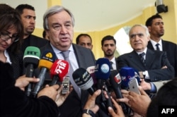 FILE - United Nations Secretary-General Antonio Guterres, left, speaks to the press before departing from Benina International Airport in Libya's eastern city of Benghazi, April 5, 2019.