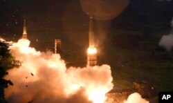 In this photo provided by S. Korea Defense Ministry, South Korea's Hyunmoo II Missile system fire missiles during the combined military exercise between the U.S. and South Korea at an undisclosed location in South Korea, July 29, 2017.