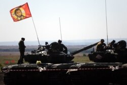 Main battle tanks of the self-proclaimed "Donetsk People's Republic" take part in a "tank biathlon" competition.