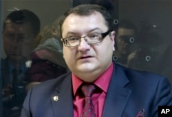 FILE - In this grab taken from Associated Press Television footage on Nov. 3, 2015, Yuri Grabovsky speaks during a trial hearing at the Holosiivskyi District Court in Kyiv, Ukraine. A lawyer for two Russian servicemen on trial in Ukraine has been found dead.