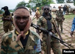 FILE - Before a mission, Seleka fighters gather in the town of Lioto, Central African Republic.