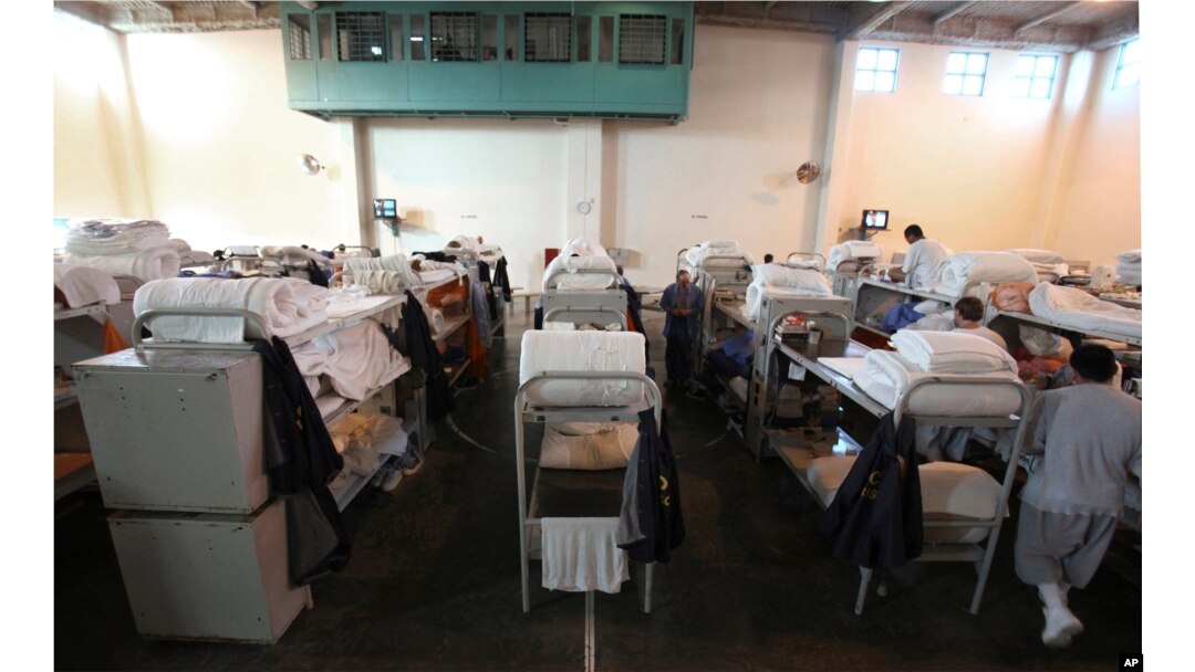 FILE - In this Jan. 14, 2009 file photo, triple-tier bunks are seen in a gymnasium converted to house prisoners at the California Substance Abuse Treatment Facility and State Prison in Corcoran, Calif.
