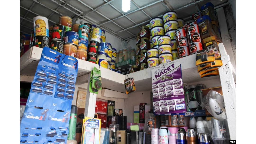 Provisions are displayed at a store in Obalende market in Lagos, Nigeria, March 3, 2016. (C. Stein/VOA)