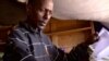 Adam Yousuf from Somalia shows his old UN papers.