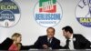 FILE - From left, Brothers of Italy's Giorgia Meloni, Forza Italia's Silvio Berlusconi, and the League's Matteo Salvini attend a media event for center-right leaders ahead of the March 4 general elections, in Rome, Italy, March 1, 2018. 