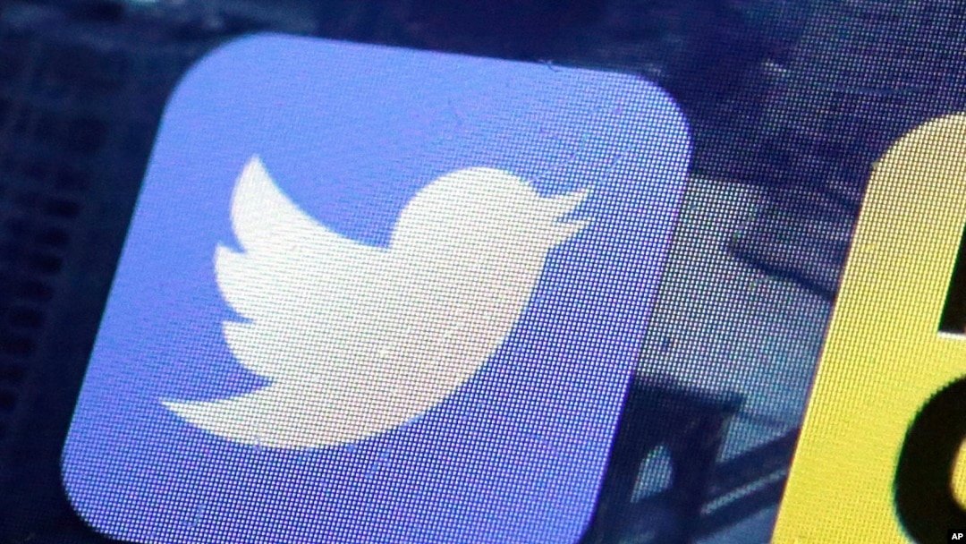 FILE - This Oct. 18, 2013, file photo, shows a Twitter app on an iPhone screen in New York. 