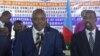 Newly elected Somalia's autonomous South West State President Abdiaziz Hassan Mohamed, left, delivers his speech after being elected among five candidates by legislators in Baidoa, Somalia, Dec. 19, 2018.