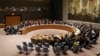 FILE - The United Nations Security Council votes on a resolution during a meeting at U.N. headquarters, March 2, 2016.