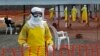 Medicins Sans Frontieres (MSF) health workers prepare at ELWA's isolation camp during the visit of Senior United Nations (U.N.) System Coordinator for Ebola David Nabarro, at the camp in Monrovia Aug. 23, 2014.