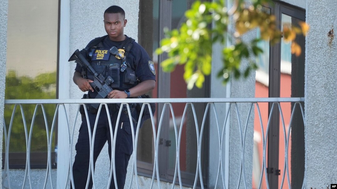 An officer patrols outside the courthouse where Ryan Wesley Routh, suspected in an apparent assassination attempt of former President Donald Trump, will attend a hearing, in West Palm Beach, Florida, Sept. 23, 2024. Routh's son has been arrested on child sexual abuse charges.
