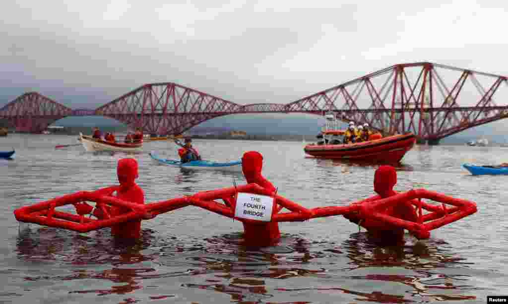 Swimmers participate in the New Year's Day Loony Dook swim at South Queensferry in Scotland, Britain.