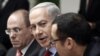 Israel's Prime Minister Benjamin Netanyahu (C) attends the weekly cabinet meeting in Jerusalem, December 9, 2012. 
