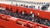 Migrants are seen aboard a navy ship before being disembarked in the Sicilian harbor of Augusta, June 1, 2014.