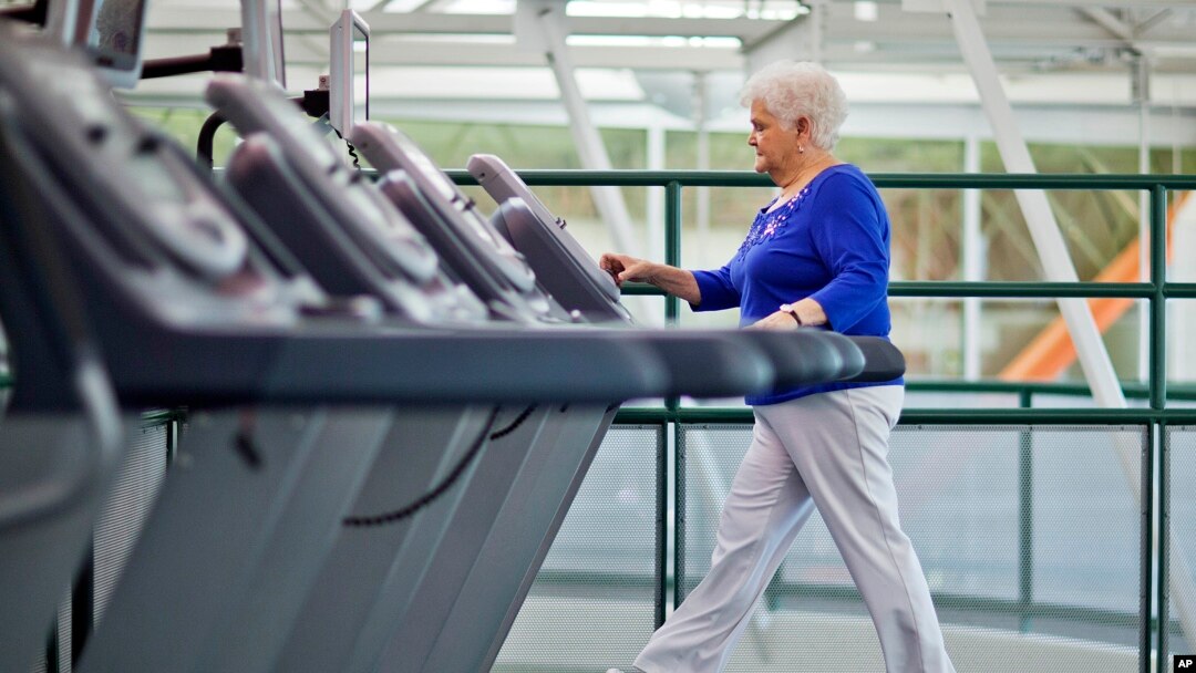 FILE - A woman with diabetes walks on a treadmill as part of an exercise program to help control the disease. Researchers who recently linked diabetes with cognitive and memory issues say keeping fit can help decrease the risk of vascular dementia in diabetics.