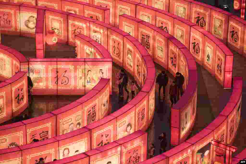 People walk in a maze at the Tang Paradise Park in Xi'an, Shaanxi province, China, ahead of the coming Lunar New Year, marking the Year of the Dog.