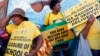 Supporters of President Jacob Zuma's ruling African National Congress await the start of a march to the headquarters of the opposition Democratic Alliance in Cape Town, South Africa, Feb. 5, 2014.