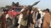 FILE - Taliban fighters gather in Surkhroad district of Nangarhar province, east of Kabul, Afghanistan, Saturday, June 16, 2018.
