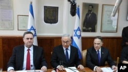 Israeli Prime Minister Benjamin Netanyahu center, Foreign Minister Israel Katz, left, and the government secretary Tzachi Braverman, attend the weekly cabinet meeting at the Prime Minister's office in Jerusalem, Nov. 10, 2019.