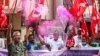 Activists of various organizations celebrate news of the repeal of farm laws they were protesting against in Hyderabad, India, Nov. 19, 2021.