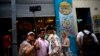 FILE - Tourists take a selfie at the Bodeguita del Medio bar in Havana, Cuba, April 28, 2017.