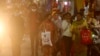 People wearing face masks as a precaution against the coronavirus shop at a market place in Jammu, India, Nov. 22, 2021.