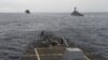 FILE - U.S. Navy ships are seen from the bridge of the guided-missile destroyer USS Spruance, in the South China Sea, Oct. 17, 2016, in a photo provided by the U.S. Navy.