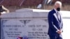 President Joe Biden walks away after a wreath laying at the tomb of the Rev. Martin Luther King Jr., and his wife, Coretta Scott King, Jan. 11, 2022, in Atlanta, Georgia.