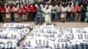 Pakistanis attend a funeral for unclaimed people who died of extreme weather, in Karachi, Pakistan, June 26, 2015. 
