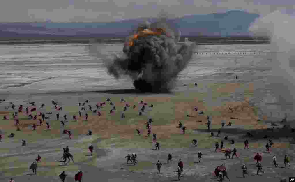 Bolivian soldiers re-enact the battle of &quot;Canchas Blancas,&quot; which took place during the Pacific War in 1879 when Bolivia lost to Chile and in effect lost its access to the sea, in Canchas Blancas, Bolivia, the sight of the actual battle, March 28, 2019.