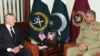 FILE - U.S. Defense Secretary James Mattis, left, meets with Pakistan's army chief Gen. Qamar Javed Bajwa in Rawalpindi, Pakistan, Dec. 4, 2017.