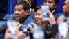 Philippine President Rodrigo Duterte arrives at an event with Filipino community in Hong Kong, April 12, 2018.