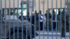 Israeli troops gather at the scene of what an Israeli police spokeswoman said was a car-ramming attempt by a Palestinian at the West Bank checkpoint of Qalandia, near Ramallah, Dec. 18, 2015. 