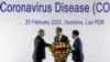 China's Foreign Minister Wang Yi, center, talks with Philippines Foreign Affaires Secretary Teodoro Locsin Jr., left and Laos Foreign Minister Saleumxay Kommasith following a meeting on the Novel Coronavirus Pneumonia in Vientiane, Laos, Feb. 20, 2020.