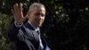FILE - President Barack Obama waves as he walks toward Marine One on the South Lawn of the White House in Washington, before a short trip to Andrews Air Force Base, Md.