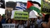 FILE - Israeli Arabs and their supporters take part in a rally to protest against Jewish nation-state law in Rabin square in Tel Aviv, Israel, Aug. 11, 2018.