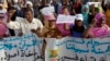 FILE - Mauritanian anti-slavery protesters march to demand the liberation of an imprisoned abolitionist leader in Nouakchott, May 26, 2012.