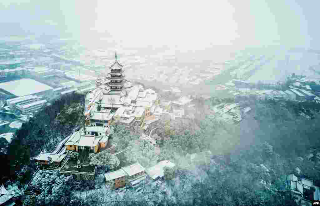 An aerial view of Langshan Mountain after snowfall in Nantong in China's eastern Jiangsu province.