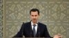 FILE - Syria's President Bashar al-Assad speaks during a meeting with heads of local councils, in Damascus, Syria, Feb. 17, 2019.