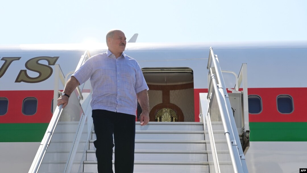 Belarus' President Alexander Lukashenko disembarks from a plane as he arrives at an airport in Sochi on Sept. 14, 2020. 