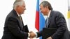 FILE - Igor Sechin, CEO of state-controlled Russian oil company Rosneft, right, and Exxon Mobil Corp. CEO Rex Tillerson shake hands after signing an agreement at the Black Sea port of Tuapse, southern Russia, June 15, 2012. 