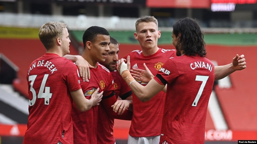 'Yan wasan Manchester United suna murnar shan kwallo, Afrilu 18, 2021.
