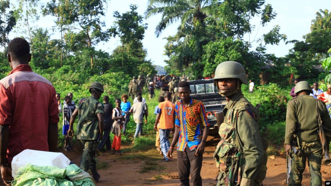 In this photo taken Friday, Oct 5, 2018, Congolese Soldiers patrol in an area civilians were killed by The Allied Democratic Forces rebels in Beni, Eastern Congo. 