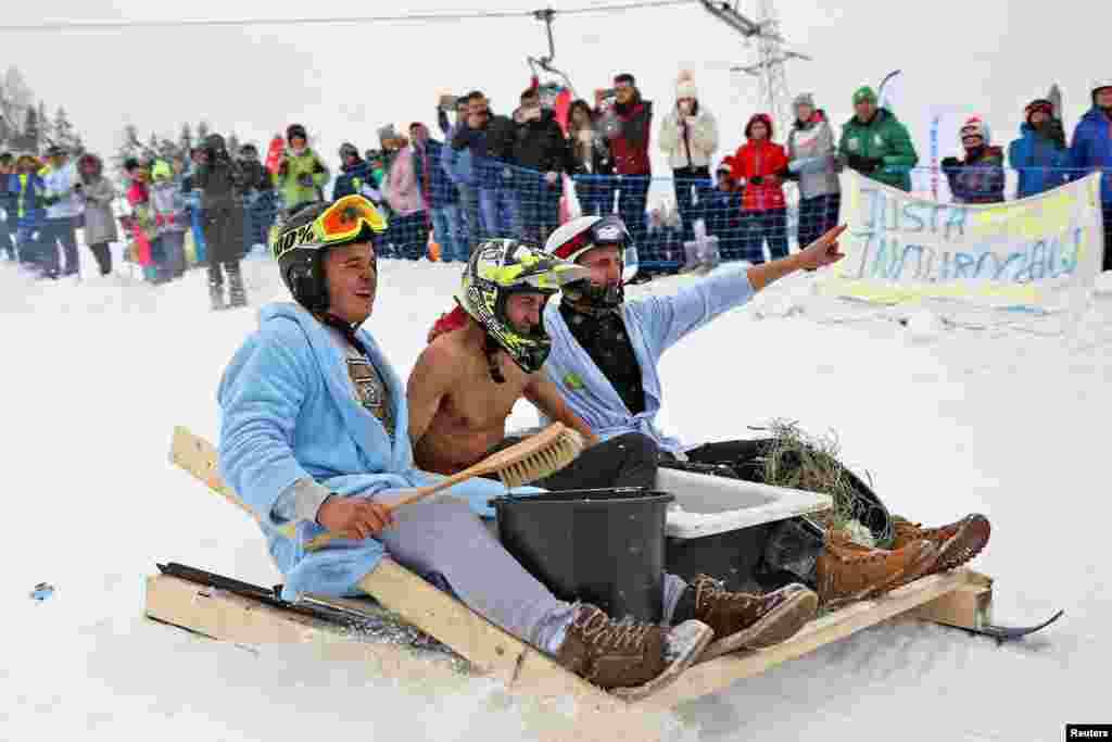 Competitors take part in the "Riding on Anything" championships organized in Bialka Tatrzanska, Poland, Feb. 18, 2018.