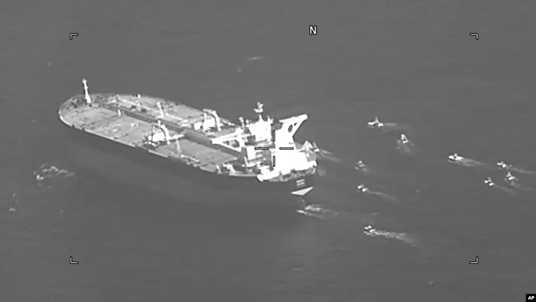 This still image from video released by the U.S. Navy shows the Panama-flagged oil tanker Niovi surrounded by Iranian Revolutionary Guard vessels in the Strait of Hormuz Wednesday, May 3, 2023. 