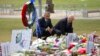 President Barack Obama and Vice President Joe Biden visit a memorial to the victims of the Pulse nightclub shooting in Orlando, Florida, June 16, 2016.