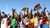 FILE - People gather in support of a coup that ousted President Roch Kabore, dissolved government, suspended the constitution and closed borders in Burkina Faso, Ouagadougou, Jan. 25, 2022.