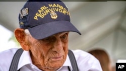FILE - Pearl Harbor survivor Harry Chandler of Tequesta, Florida, speaks to the media during the 82nd Pearl Harbor Remembrance Day ceremony at Pearl Harbor in Honolulu, Dec. 7, 2023.