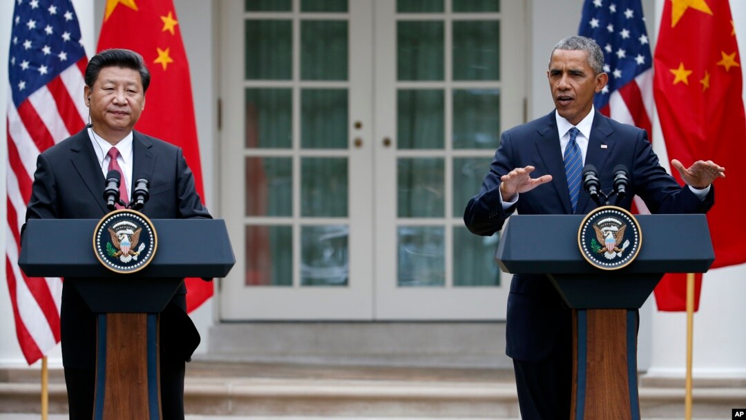 President Barack Obama gestures during a joint news conference with Chinese President Xi Jinping, Sept. 25, 2015, in the Rose Garden of the White House in Washington.