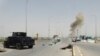 Smoke rises from a bomb attack in clashes between Iraqi security forces and Islamic State militants on the outskirts of Ramadi, April 9, 2015. 